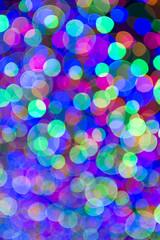Holiday Christmas tree lights background in bright and colorful bokeh abstract
