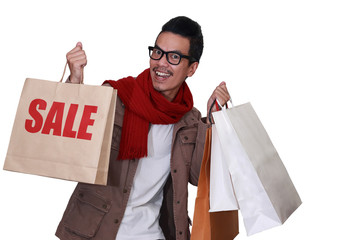 Glasses smile Man Holding Shopping Bags with word sale Isolated On white Background.