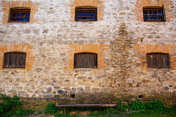 Fototapeta na wymiar Six windows on old building