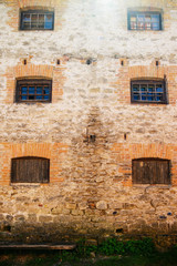 Fototapeta na wymiar Six windows on old building