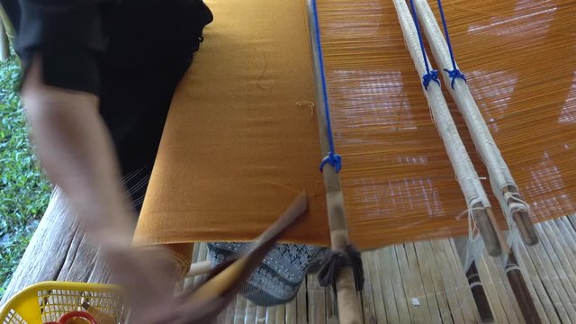 People are silk weaving in Thailand