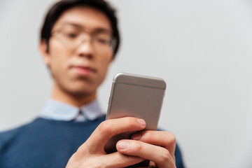 Asian man looking at the phone