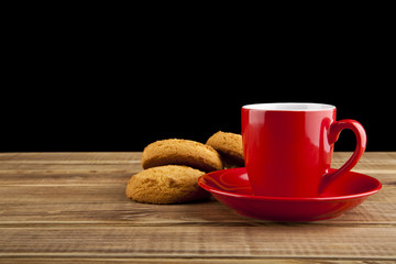 red Cup of coffee and homemade biscuits
