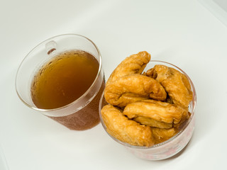 The thai dessert of curry puff and a cup of tea.