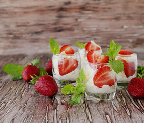 Strawberries with cream or tiramisu . selective focus