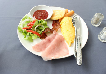 English breakfast with fried eggs, bacon, sausages ,toasts and f