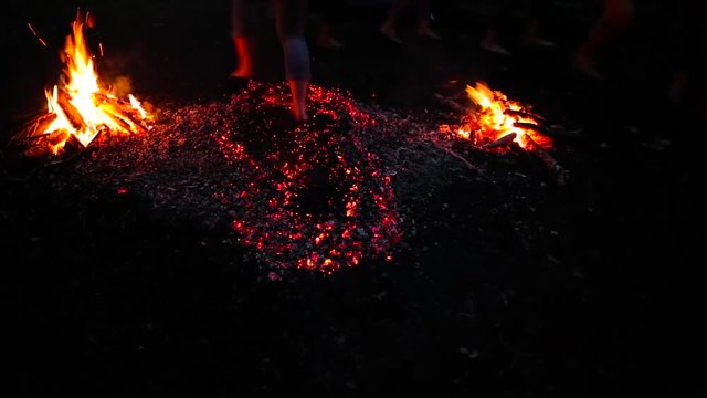 people running barefoot on fire.