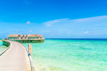 Beautiful water villas in tropical Maldives island  .