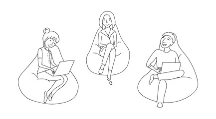 People sitting and working in a bean bag chair