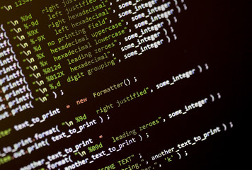 Code language on a computer screen with shallow depth of field.