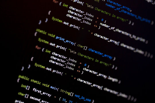 Code language on a computer screen with shallow depth of field.