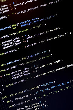 Code language on a computer screen with shallow depth of field.