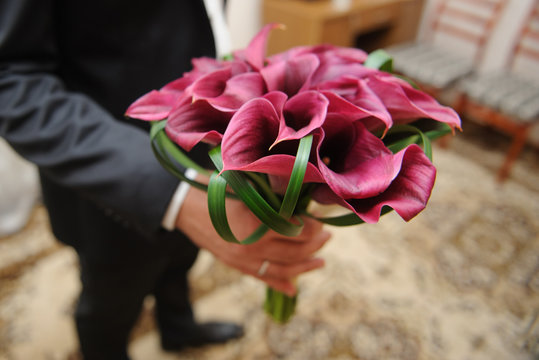 Groom with Violet Calla Bouquet