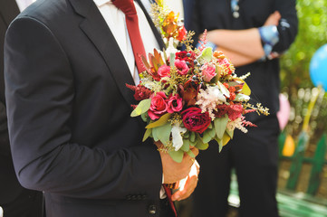 Groom with Red Bouquet