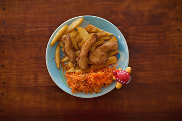Meal for kids on the plate with little airplane. Funny food for children