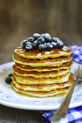Pancakes with honey and blueberry.Top view.