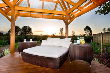 Bed in outside area like a patio or relaxing place of a modern h