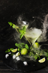 Martini or mint liqueur with lime, selective focus