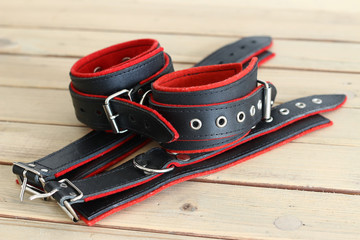 Leather cuffs for hands and legs for erotic games