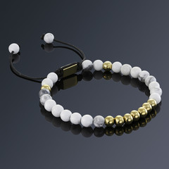 Lucky stone bracelet isolated on black background