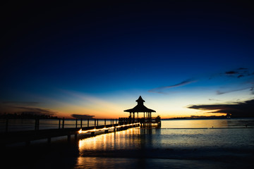 Fototapeta na wymiar gazebo bridge sea at sunset