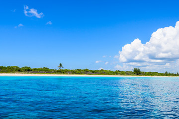 open blue sea cumulus clouds