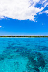 open blue sea cumulus clouds