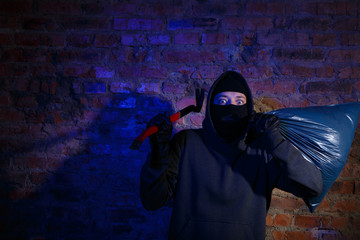 Astonished thief at near wall
