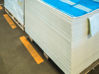 pile of papers in difference colors ready to make a books in pap