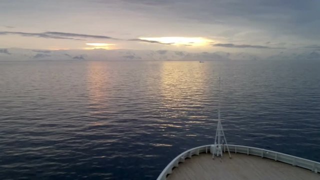 Sunrise over Brabant Island, Gerlache Strait, Antarctica. Brabant island is the second largest island in the Palmer Archipelago. Large ice-cliffs protect its coastline from the sea.