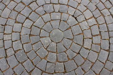 Vintage round stone pavement. Top view of black stone pavement pattern