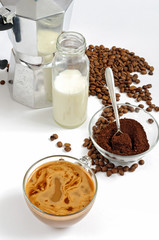 Coffee beans and ground, milk in a bottle, Moka pot