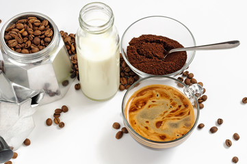Coffee beans and ground, milk in a bottle, Moka pot