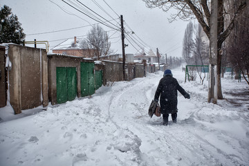 Snow storm hits city. street after blizzard