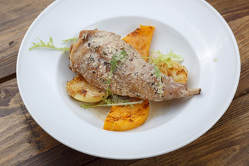 chicken in sauce with herbs, potatoes and pumpkin