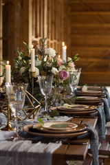 Laid Table By wedding banquet in a barn. Vertical frame