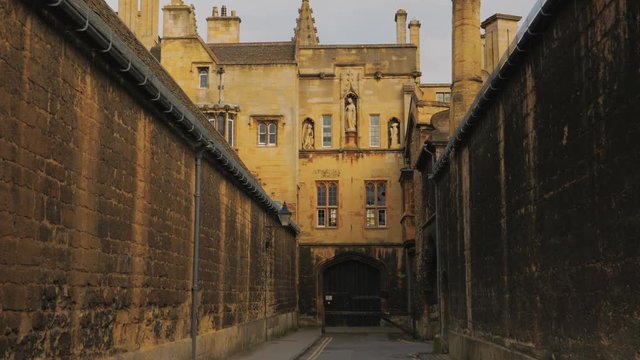 A cinematic POV walk across an alleyway in the town of Oxford, England, UK. Oxford is known worldwide as the home of the University of Oxford, the oldest university in the English-speaking world
