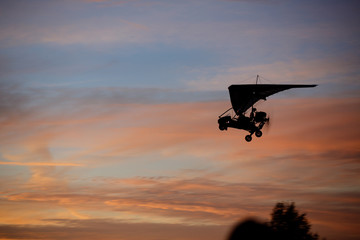 Hang glider flying in sky