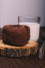 Chocolate dessert and a glass of milk on the kitchen table
