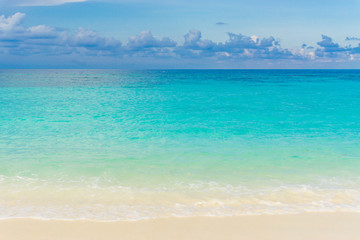 Tropical sea beach blue sky sand sun daylight