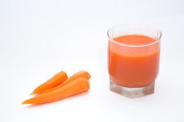 carrots and carrot juice in a glass