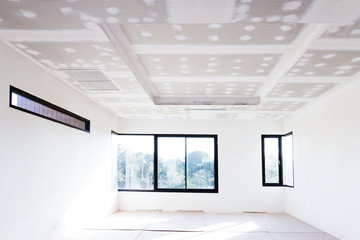 Empty room interior build gypsum board ceiling and Air conditioner in construction site