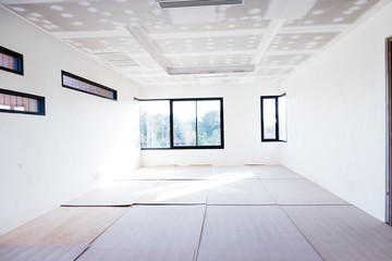 Empty room interior build gypsum board ceiling and Air conditioner in construction site - obrazy, fototapety, plakaty