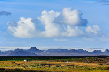 Fototapeta premium Landscape with highway and icelandic mountain range