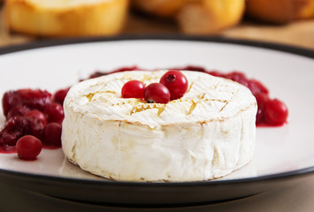 Baked Camembert with cranberries and toasted bread