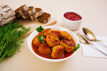 Small meat balls with peas and parsley. Fried noisettes with and rye bread