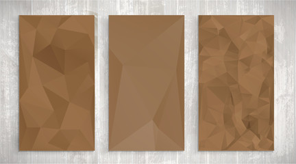Set of brown wrinkled stylized paper on wooden background