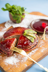 Traditional breakfast with pancakes and jam