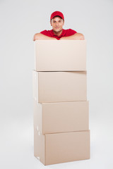 Delivery man behind the boxes