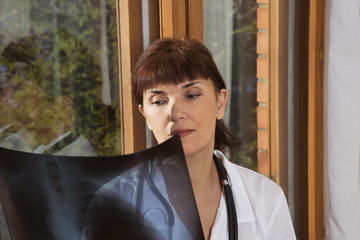 doctor examines a radiograph